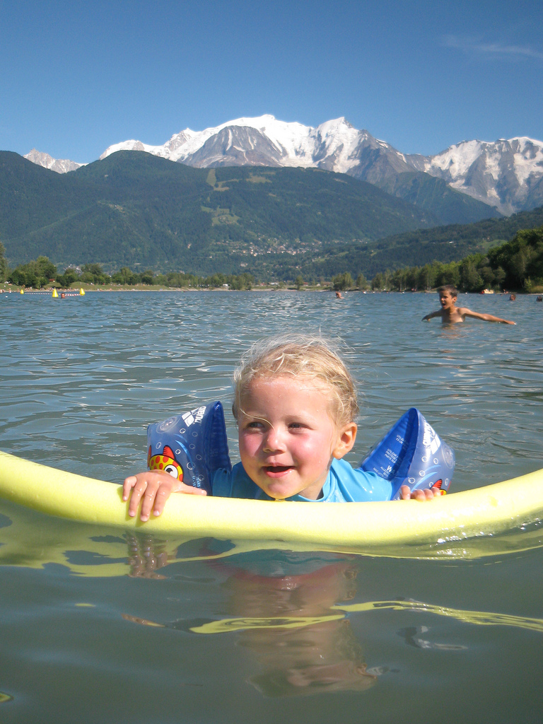 swimming in warm water with snow in the background
